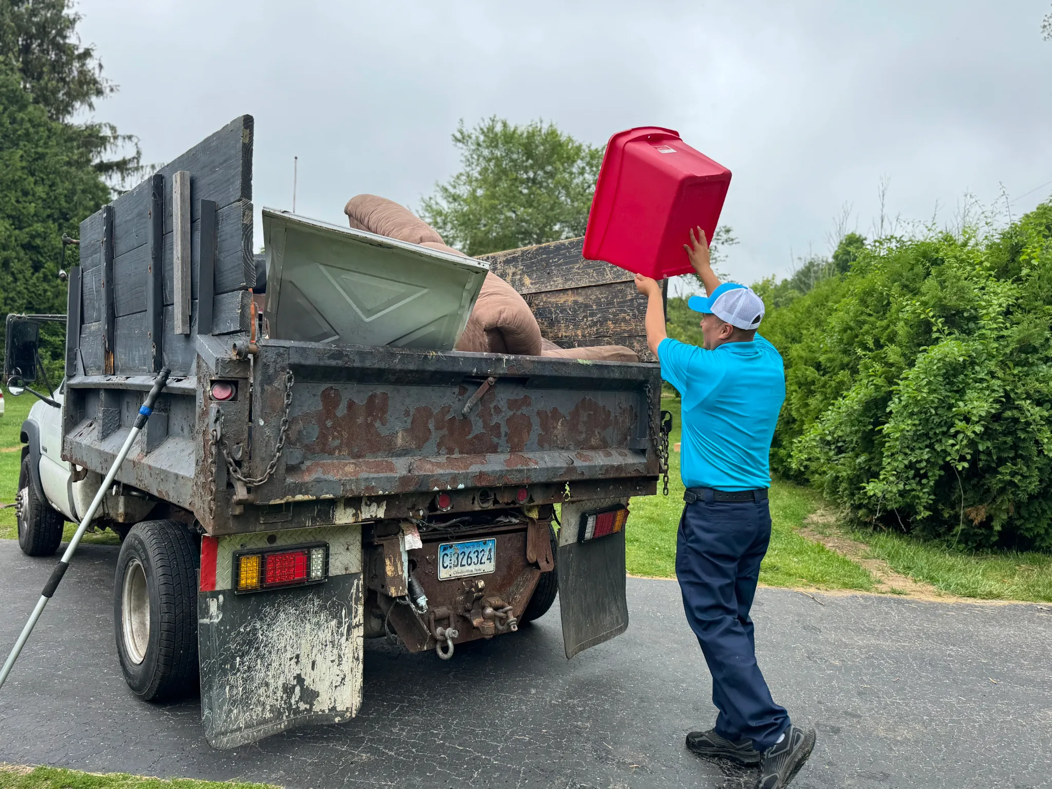 Family Cleanout crew loading a dump truck during an eviction cleanout in Connecticut