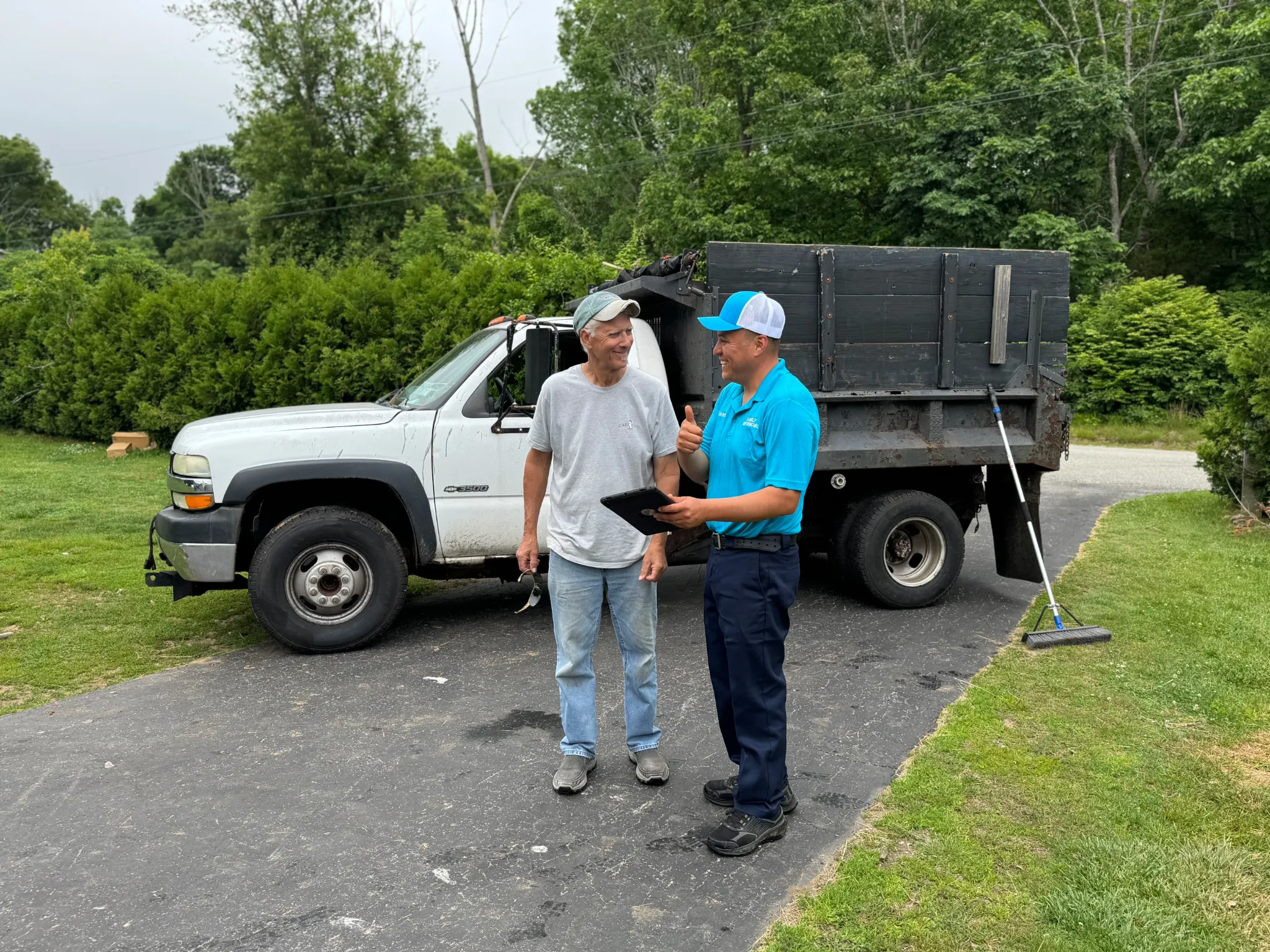 Family Cleanout Junk Removal team member answering questions at a customer's home in Norwich, CT