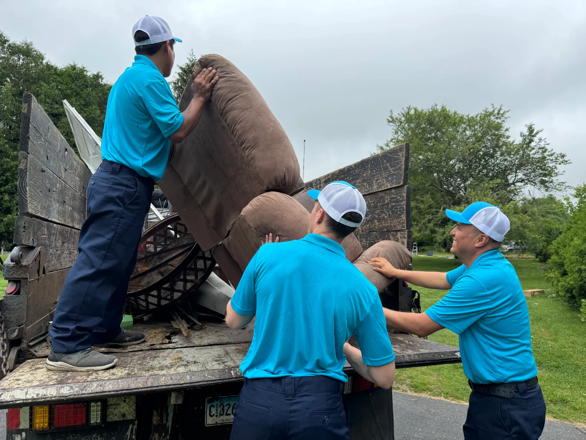 Family Cleanout team completing a full estate cleanout in Norwich, CT — furniture and belongings loaded and ready