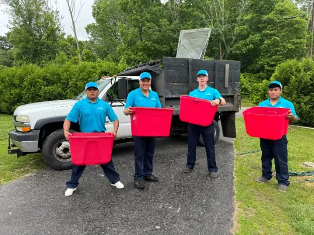 Family Cleanout Junk Removal team with red-bin truck serving Putnam, CT