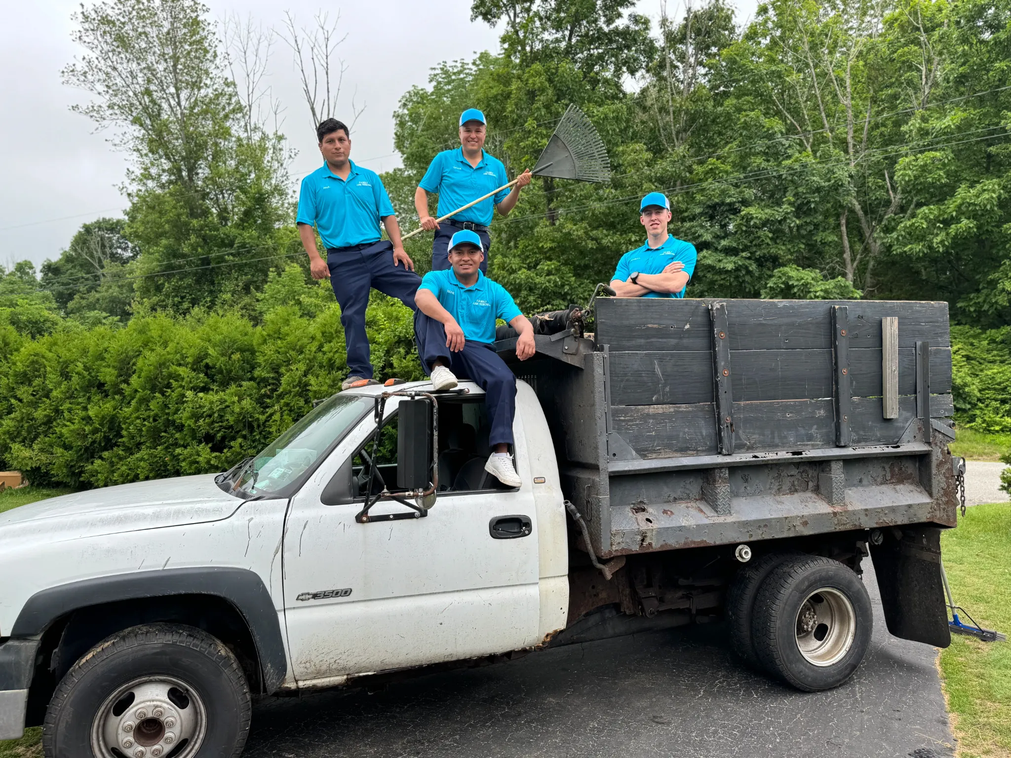 Family Cleanout crew with landscaping truck for yard waste removal in Eastern Connecticut